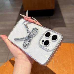 Detail of glitter iPhone case with 3D silver bead bowknot and clear edges for women