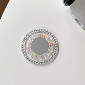 Detail of round telescopic phone stand with rhinestones, colorful dots and mirror surface