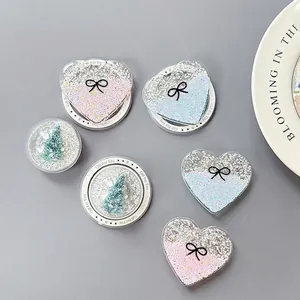 Glitter heart and Christmas tree phone sockets with Gift For You base on a ceramic plate