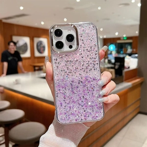 Detail of pink and purple glitter sequins on transparent iPhone 16 Pro Max case