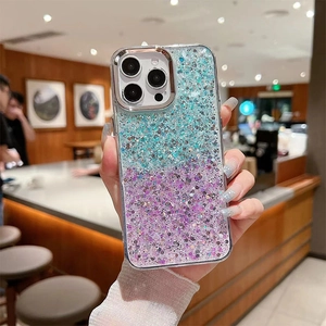 Detail of gradient glitter phone case with sparkles for iPhone 16 Pro Max held by a model
