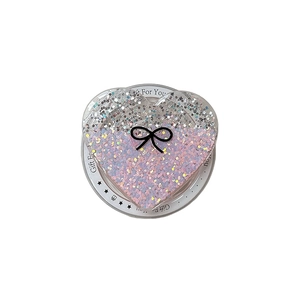 Glitter heart phone grip with bow design on gift card for festive Christmas gifting