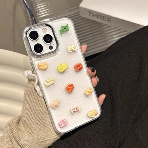 Creative 3D food model iPhone case with fried egg and sushi charms on a clear back