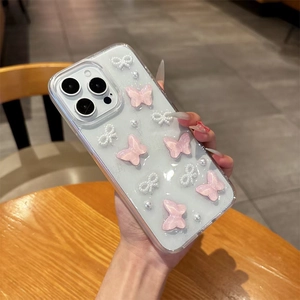 Coque iPhone pailletée avec papillons 3D roses et nœuds en perles blanches