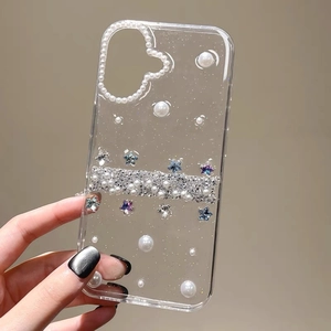 Detail of iPhone case with glitter flakes, pearl heart, and diamond rhinestone strap