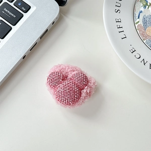 Detail of pink plush phone grip with sparkling rhinestone mouse head shape