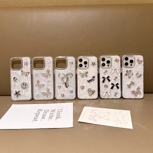 Glittering pearl white iPhone case with butterfly bow and heart charms for various models