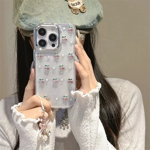Detail of glitter iPhone case with cherry pearl pattern and pink silk bow pendant