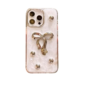 Pearlescent white iPhone case with silver 3D bowknot and metallic rivet accents