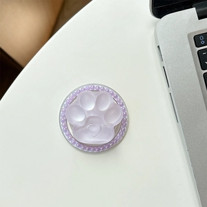 Close-up of purple cat paw magnetic phone grip with beaded edges and heart detail