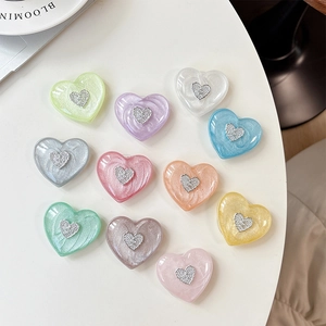 Set of 11 colorful 3D heart-shaped expanding phone stands with pearlescent finish