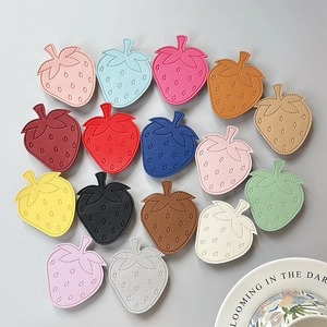 Minimalist strawberry leather phone socket grip in 16 colors with fine stitching details