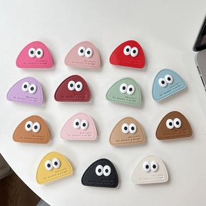 Triangle leather phone grip with big cute eyes and mountain embossing in 14 colors