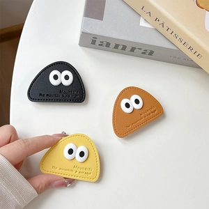 Triangle leather phone grip with cute big eyes in black, brown and yellow colors