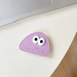 Close-up of lavender PU leather triangular phone grip with cute big eyes and stitching