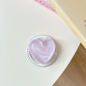Macro detail of purple pearlescent heart phone socket with Gift For You base engraving