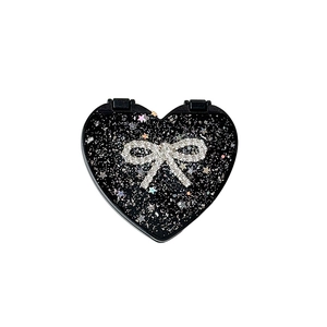 Glittering black heart shaped makeup mirror with rhinestone bow and laser stars