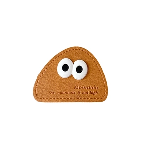 Brown leather triangle phone socket featuring big cartoon eyes and Mountain debossing