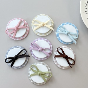 Set of 7 colorful checkered bow-tie magnetic collapsible phone sockets in various pastel tones