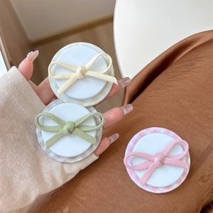 Three-piece set of cell phone grip stands with plaid bow design in cream, green and pink