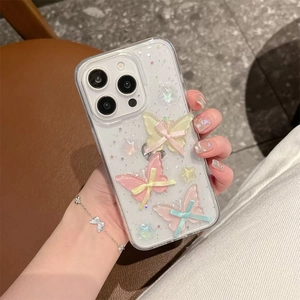 Detail of iPhone case with 3D gradient butterflies, ribbon bows and glitter star patterns