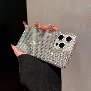 Close-up of luxury full rhinestone phone case for iPhone 16 Pro Max held by a model