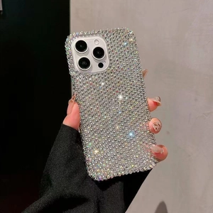 Detailed view of luxury full diamond iPhone 16 Pro Max case held in hand showing glitter