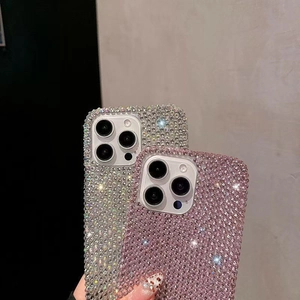 Close-up of luxury handcrafted full rhinestone phone case in silver and pink colors