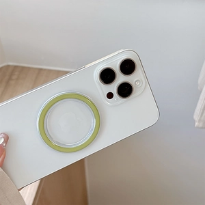Close-up of clear MagSafe phone case with a light green magnetic ring on a smartphone