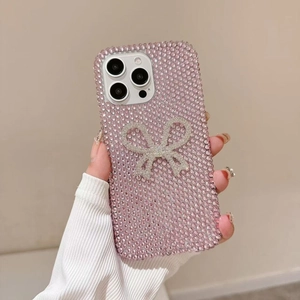 Luxury iPhone case with sparkling pink rhinestones and a large 3D silver crystal bow