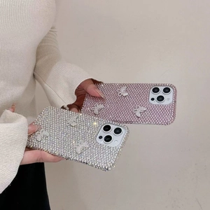Detail of luxury rhinestone phone cases with 3D butterfly decor for iPhone series