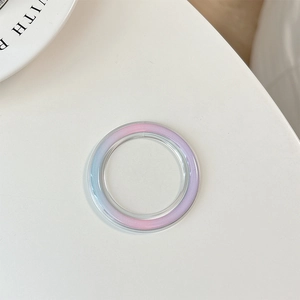 Detail of colorful gradient Magsafe phone socket base with glossy macaron finish