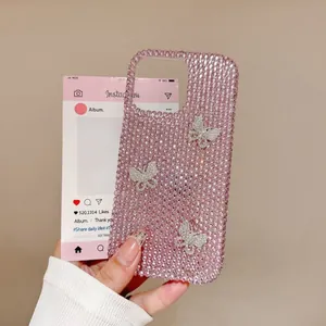 Detail of pink rhinestone iPhone case featuring silver butterflies and glitter finish