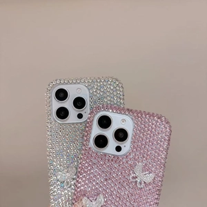 Macro shot of luxury butterfly rhinestone phone cases for iPhone 16 in silver and pink