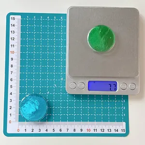 Detail view of round translucent resin phone grips showing size and 7.7g weight