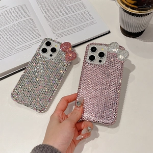 Luxury iPhone case with sparkling rhinestones and a large decorative crystal bow design
