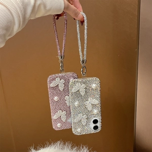 Fashionable rhinestone iPhone case with pearls, butterfly charms and matching hand strap