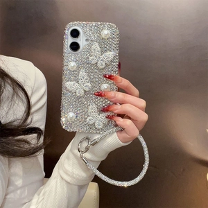 Detail of luxury rhinestone phone case with pearls, butterfly charms, and matching strap
