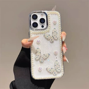 Detailed shot of iPhone case with pearls and 3D glitter butterflies decoration