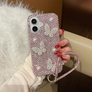 Pink rhinestone phone case with pearls and butterfly accents featuring a matching hand strap