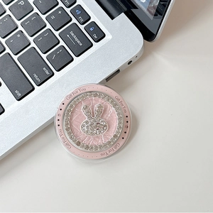 Macro shot of pink leather MagSafe grip featuring a sparkling rhinestone bunny and gift text