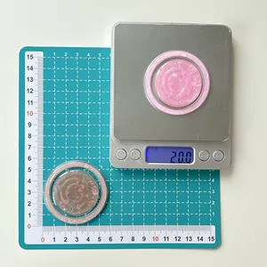Detail showing shell texture phone grip on digital scale measuring 20 grams weight