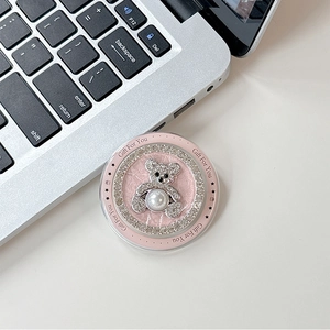 Close-up of pink MagSafe phone grip with rhinestone bear and Gift For You lettering
