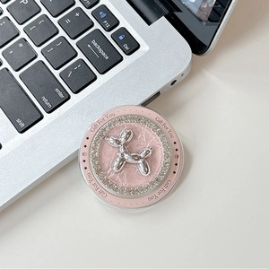 Macro shot of pink marble phone grip with silver balloon dog and rhinestone inlay