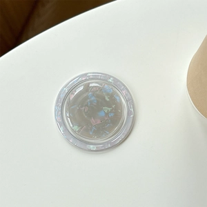 Macro shot of iridescent abalone shell texture on magnetic phone grip stand