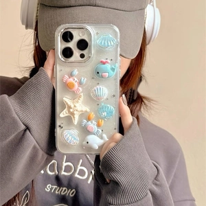 Detailed view of the ocean-themed iPhone case with 3D cartoon whale and starfish