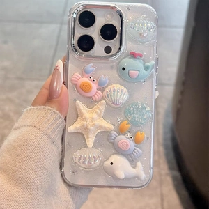 Detailed close-up of 3D resin ocean creatures and glitter on iPhone 16 Pro Max case