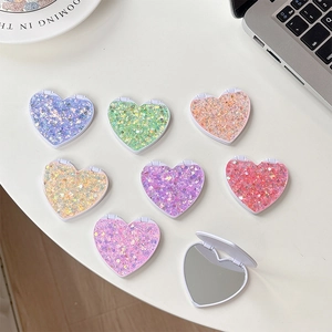 Glittery heart-shaped folding portable makeup mirrors in various sparkling colors