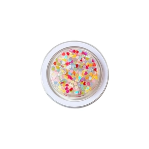 Colorful heart-shaped holographic sequins in a clear round jar for DIY crafts