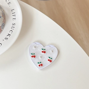 White heart-shaped folding makeup mirror with glitter resin and red cherry rhinestones